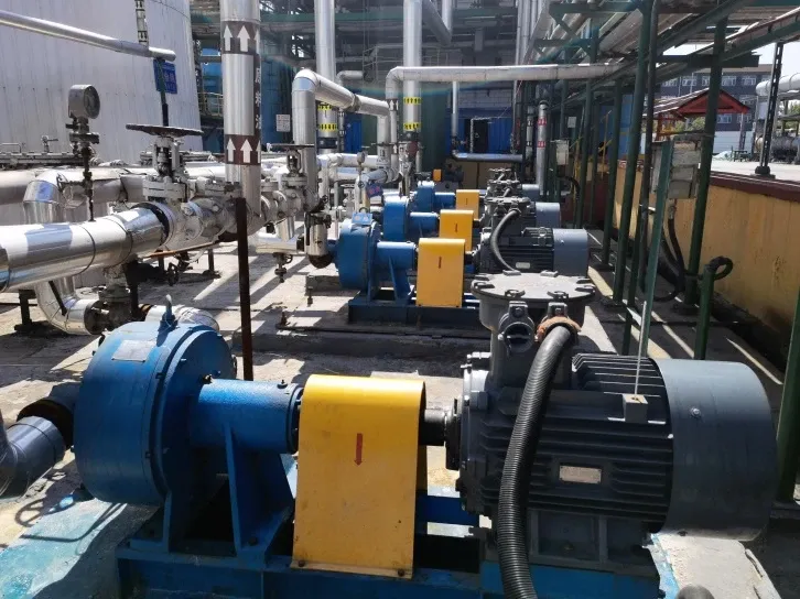 A row of EHIK pumps with yellow coupling guards and insulated process piping at the Longxing installation.