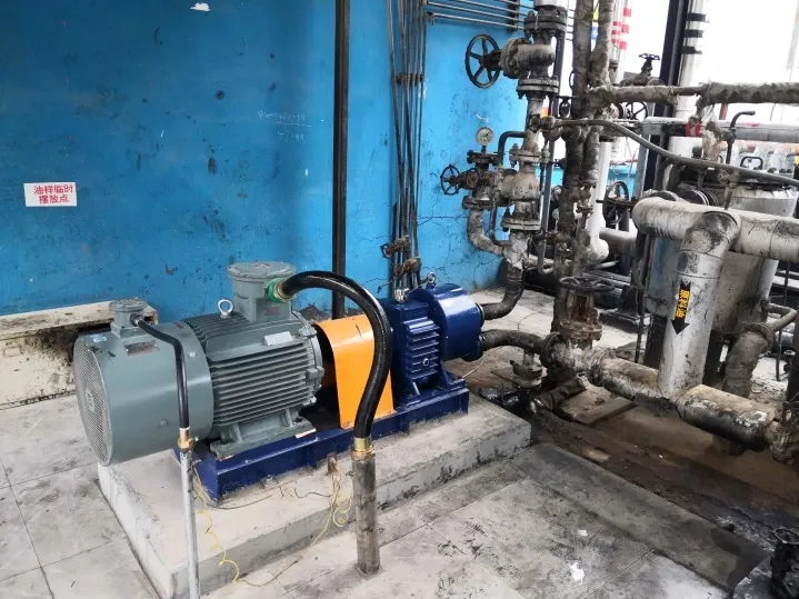 EHIK pump with a grey motor and yellow coupling guard connected to the feedstock-oil pipework at Yunwei Feihu.