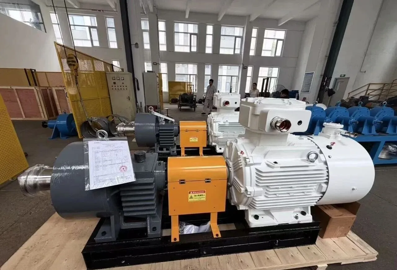 EHIK pump set with a white explosion-proof motor, orange coupling guard, gray gearbox and pump on a wooden pallet.