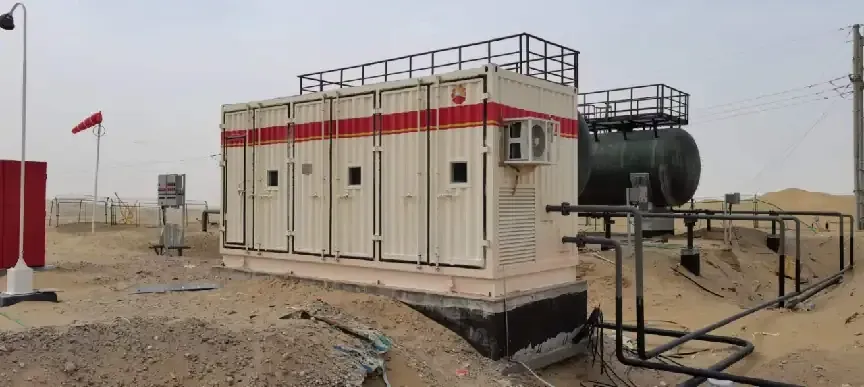 Original enclosed EHIK pump skid in the Hotan desert in 2022 with a vessel and field pipework.