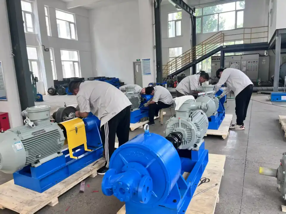 EHIK team assembling pump sets in the workshop.